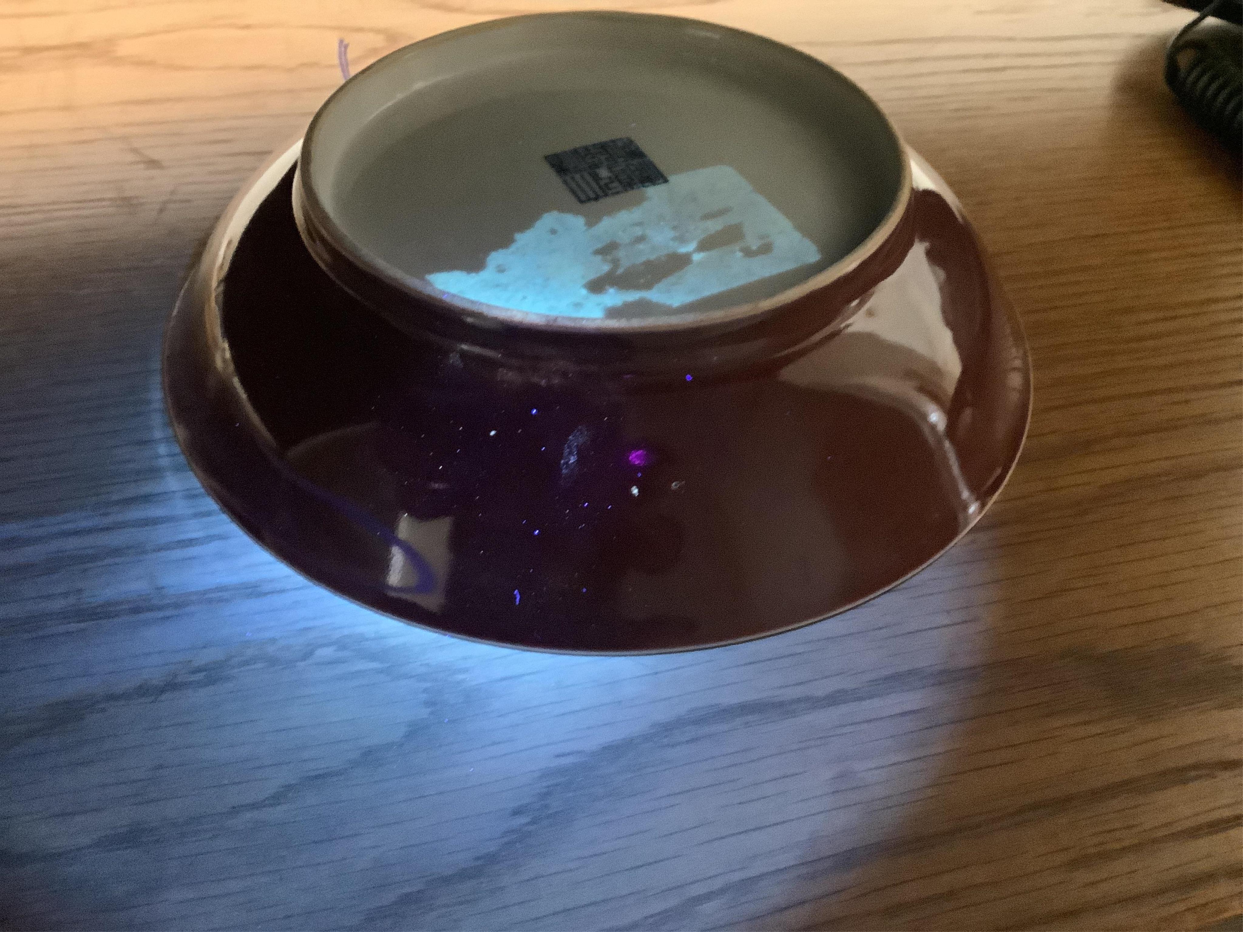 A Chinese copper-red glazed saucer dish, Qianlong six-character seal mark and of the period (1736-95)